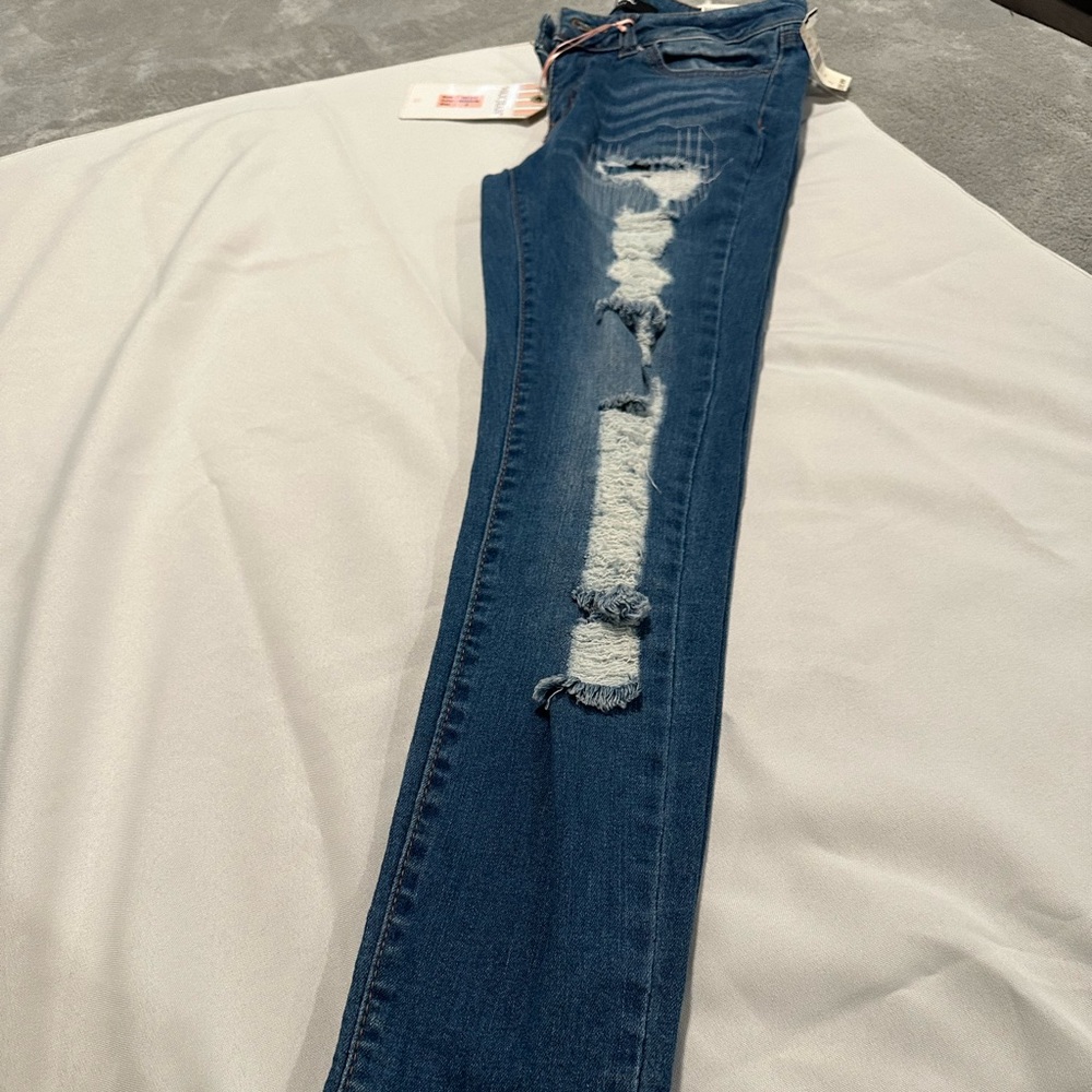 Brand with tags New Wax Blue Jeans with cuts Size 3